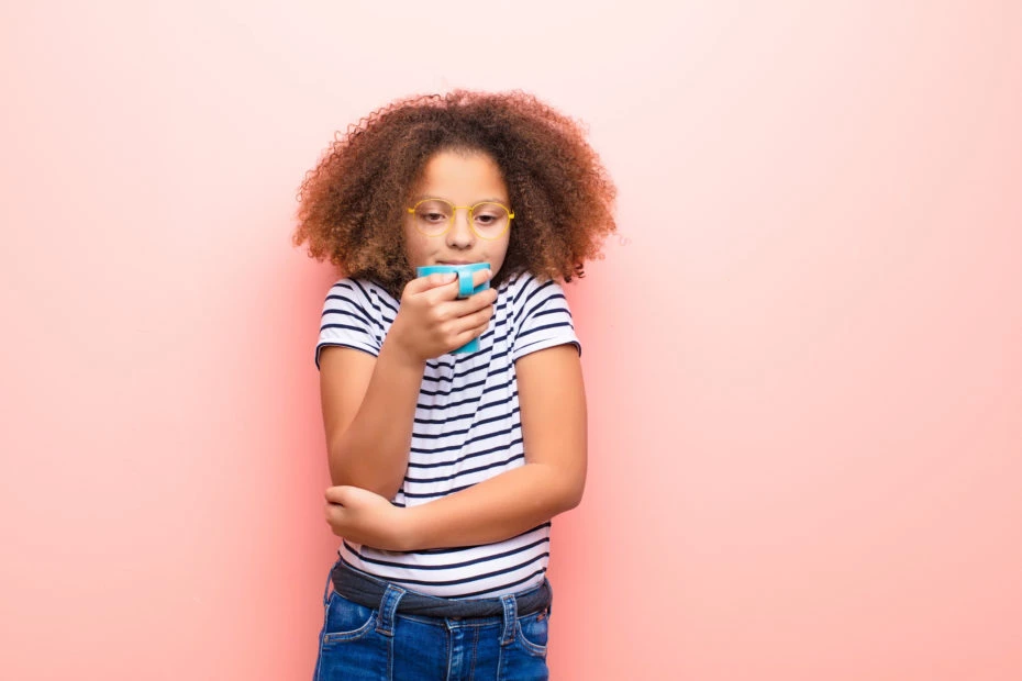 girl holding cup of caffeine coffee