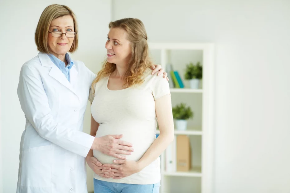 doctor-touching-belly-her-patient