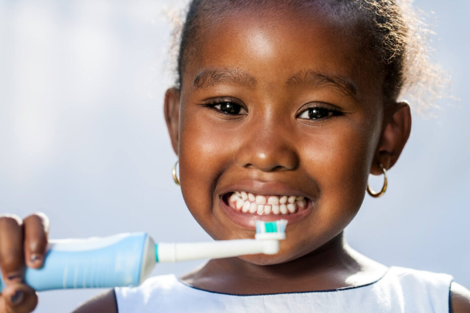 girl brushing her teeth following the instructions of her Pediatric Dentist in Pearl City