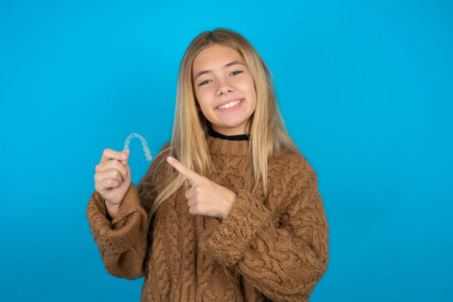 A child pointing at Invisalign in Kapolei.